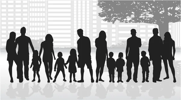 Silhouettes of family under the tree. — Stock Vector