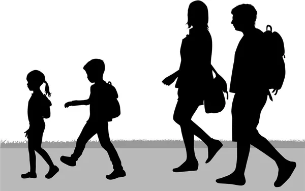 Silhouette family on a walk.