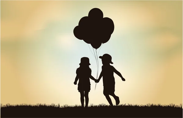 Silhouette d'enfants avec ballon . — Image vectorielle