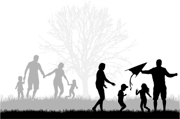 Familiensilhouetten in der Natur. — Stockvektor