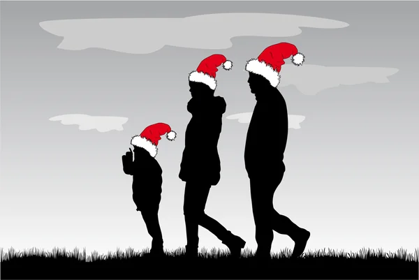 Familia de siluetas en sombreros de Navidad . — Vector de stock