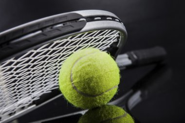 A set of tennis. Racket and ball.