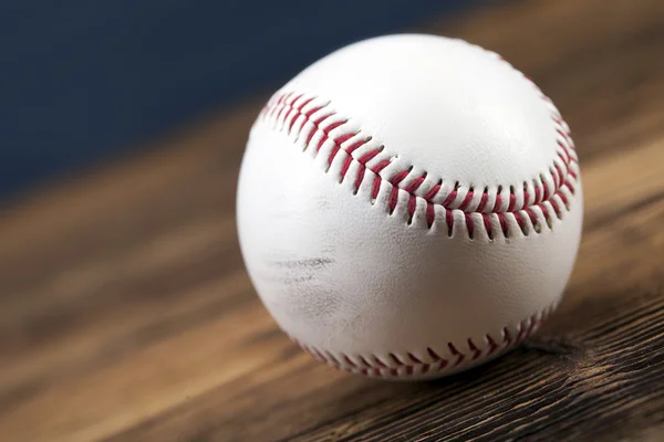 Baseball ball on wooden table — Stock Photo, Image