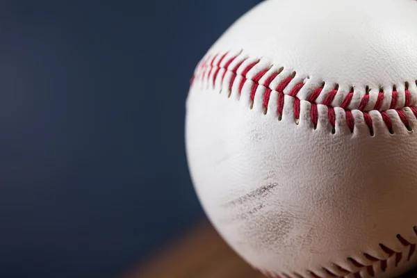 Baseball ball on wooden table — Stock Photo, Image