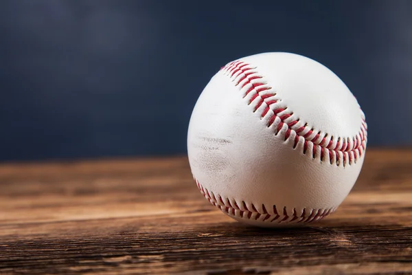 Baseball ball on wooden table — Stock Photo, Image