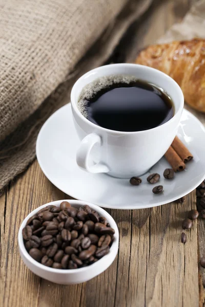 Delicious coffee with sweets on a wooden table — Stock Photo, Image