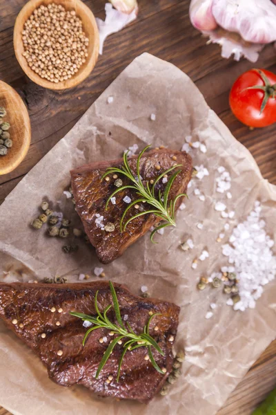 Excellent fried beef served with vegetables and spices Royalty Free Stock Images