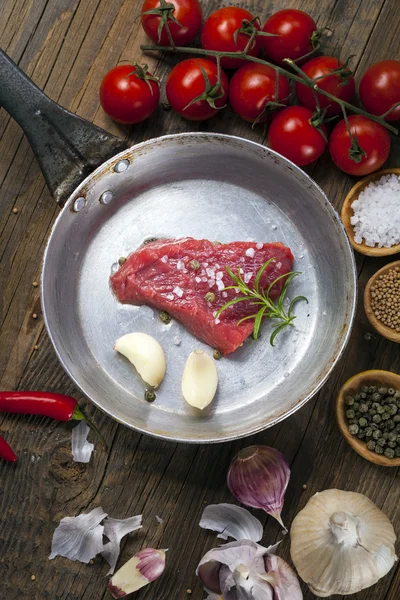 Excellent fried beef served with vegetables and spices Royalty Free Stock Photos