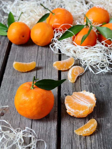 Tangerines on the gray wooden table — Stock Photo, Image