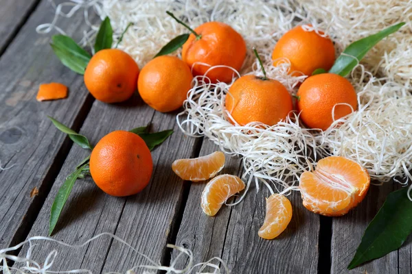 Tangerines on the gray wooden table — Stock Photo, Image