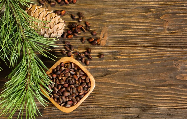 Pine Nuts Bowl Pine Cone Wooden Background Place Text — Stock Photo, Image