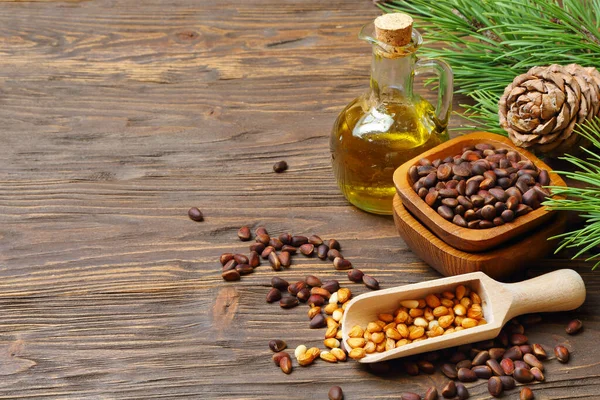 Cedar Cones Nuts Cedar Nut Oil Transparent Bottle Wooden Table — Stock Photo, Image