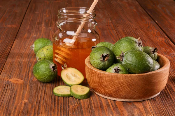 Feijoa Fruits and bank of honey — Stock Photo, Image