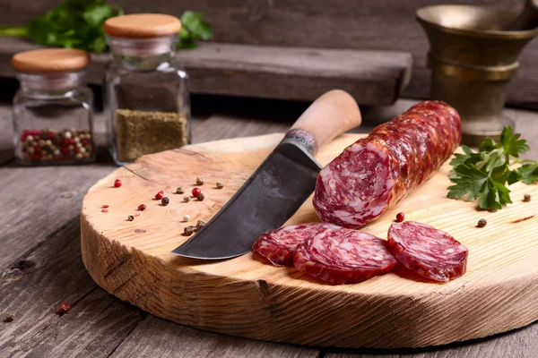 Salami and knife — Stock Photo, Image