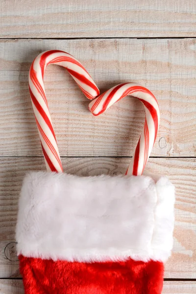Candy Canes in Christmas Stocking — Stockfoto