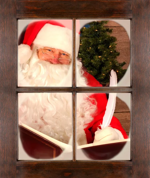Santa in Window Checking His List