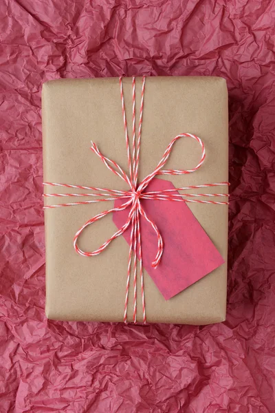 Christmas Gift on Red Tissue — Stock Photo, Image