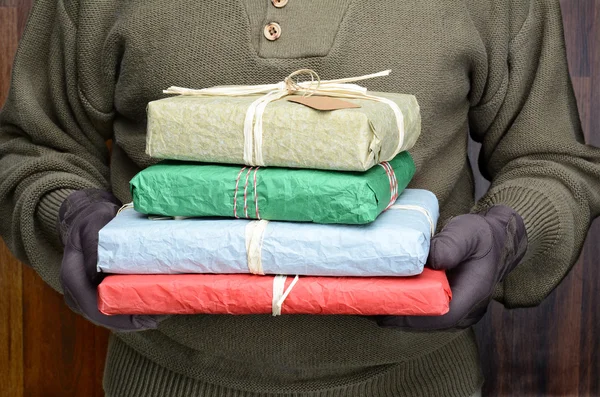 Man Holding Stack of Presents Closeup — Stock Photo, Image