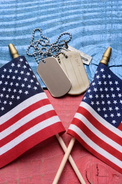 Dog Tags and Flags on Patriotic Table — Stock Photo, Image