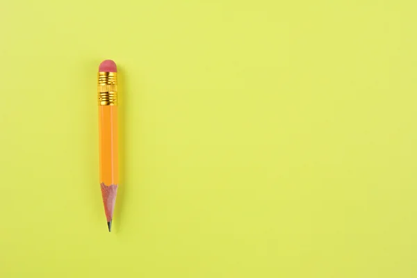 Canhoto de lápis em amarelo — Fotografia de Stock