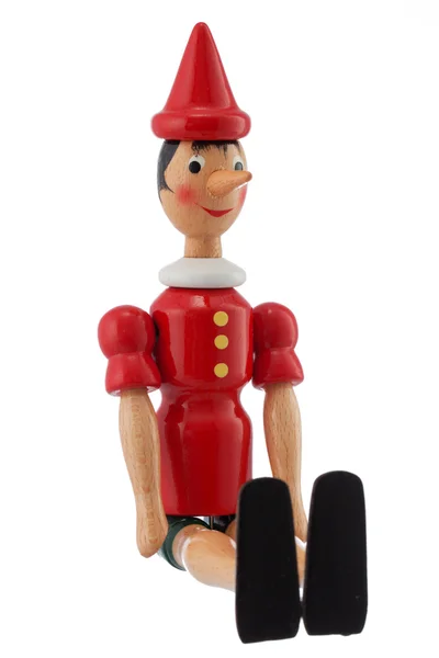 Estatua de juguete Pinocho aislada en blanco — Foto de Stock