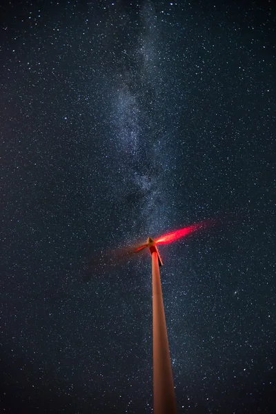 Wind turbines on the starry night sky with milkyway — Stock Photo, Image