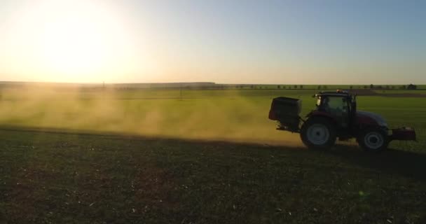 Farmer Tractor Fertilizing Wheat Field — Stock Video