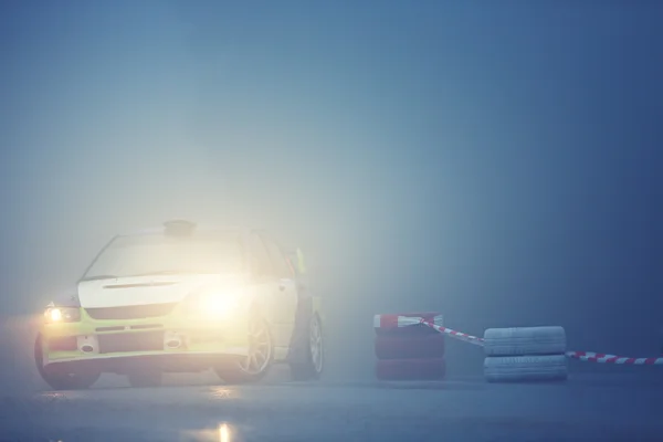 Car drives on rural road with fog — Stock Photo, Image