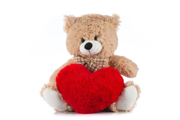 Teddy Bear drží srdce na bílém pozadí — Stock fotografie