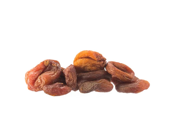 Stapel van gedroogde abrikoos vruchten op witte, gezondheid van voedsel concept — Stockfoto