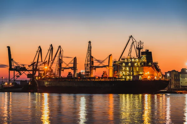 Harbor cranes in port and beautiful sunset — Stock Photo, Image