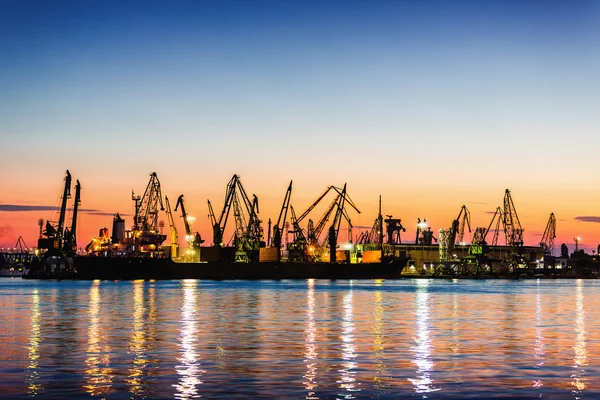 Harbor cranes in port and beautiful sunset — Stock Photo, Image