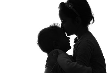 Beyaz arka plan üzerinde bebek erkek ve kız siluet. 