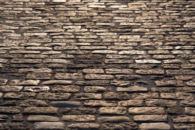 Granit taş dokulu bir arka plan olarak döşeli eski yol