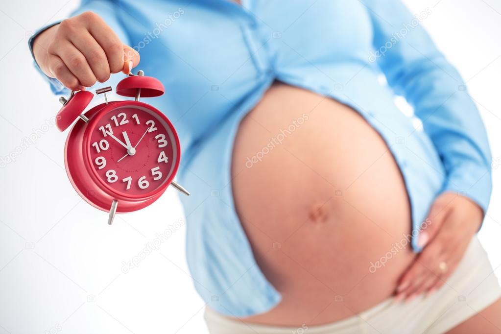 Counting hours expecting child birth. Motherhood concept. Pregna