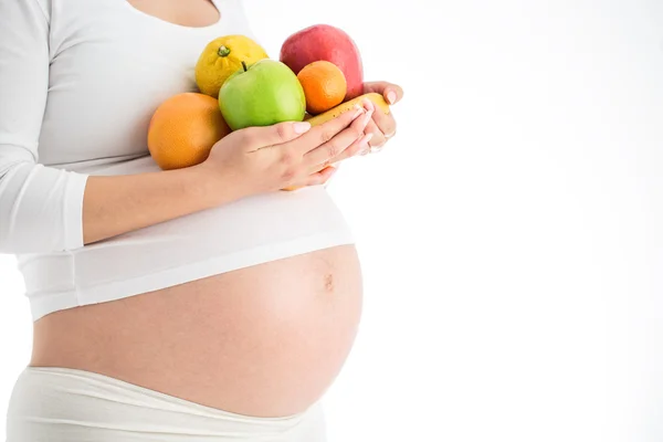 Ciąży i żywienia diety - kobieta w ciąży z owoców isolat — Zdjęcie stockowe