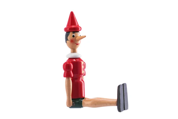Estatua de juguete Pinocho aislada en blanco — Foto de Stock