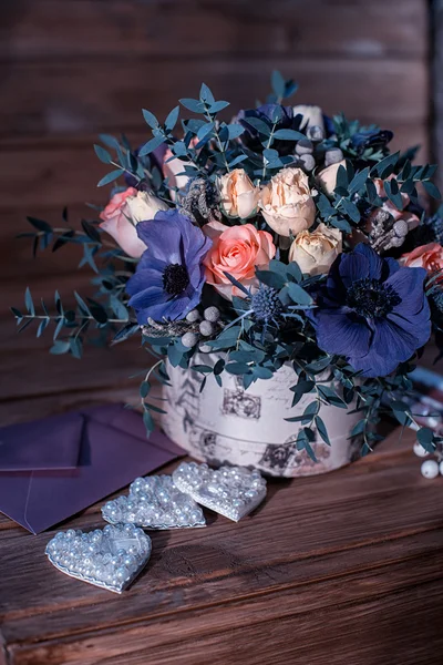 Beautiful bouquet flowers and hearts — Stock Photo, Image