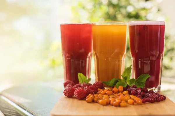 Fruit drink with cranberries raspberries and sea buckthorn — Stock Photo, Image