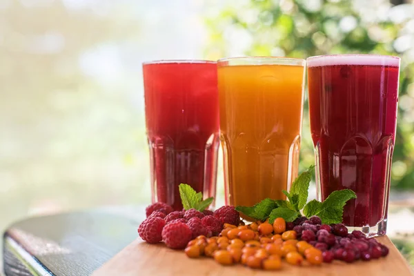 Fruit drink with cranberries raspberries and sea buckthorn — Stock Photo, Image