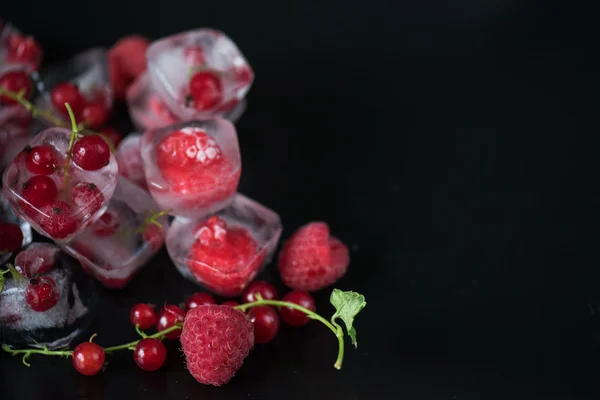 Frozen berries on wooden table — Stock Photo, Image