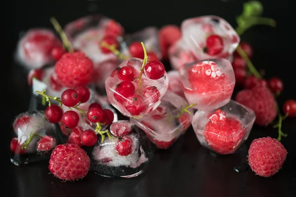 Frozen berries on wooden table — Stock Photo, Image