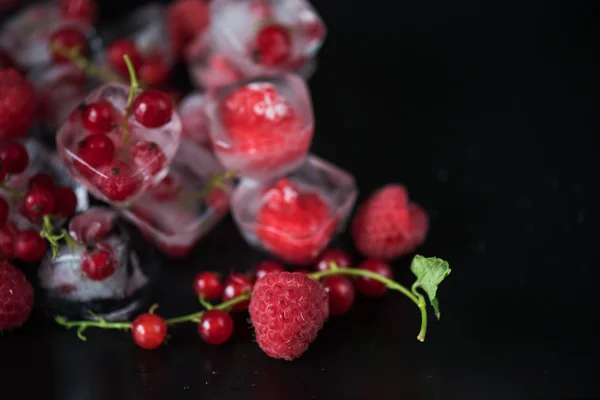 Frozen berries on wooden table — Stock Photo, Image