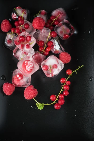 Frozen berries on wooden table — Stock Photo, Image