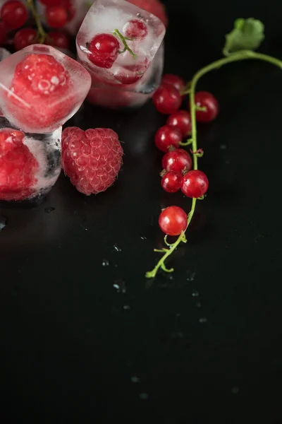 Frozen berries on wooden table — Stock Photo, Image