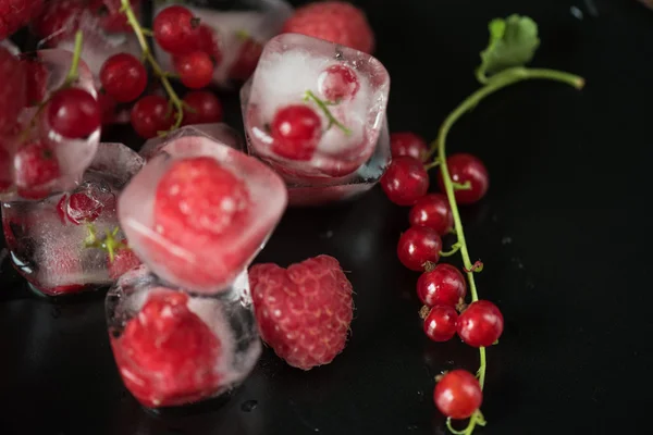 Frozen berries on wooden table — Stock Photo, Image