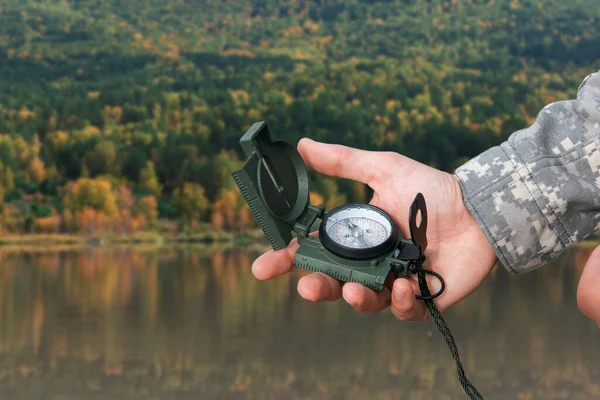 Man with compass in Altai mountains — Stock Photo, Image