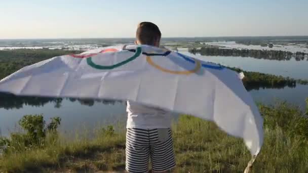 Boy waving flag the Olympic Games outdoors — Stock Video