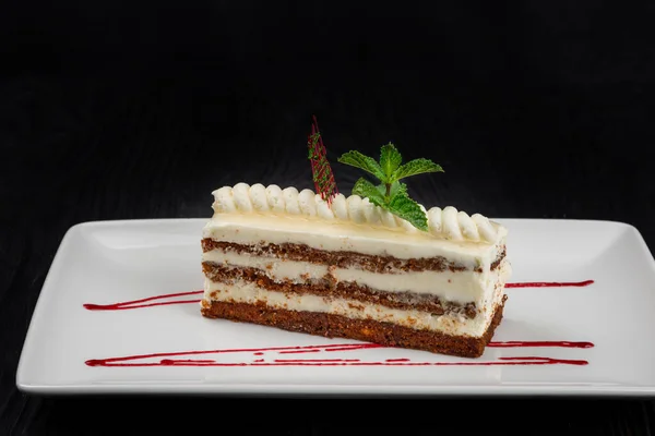 Plate with piece of delicious caramel cake — Stock Photo, Image