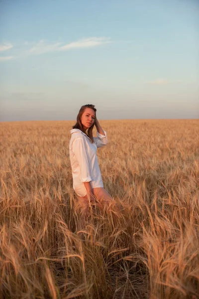 Aerial view of woman lying in the field of wheat — Stock Photo, Image